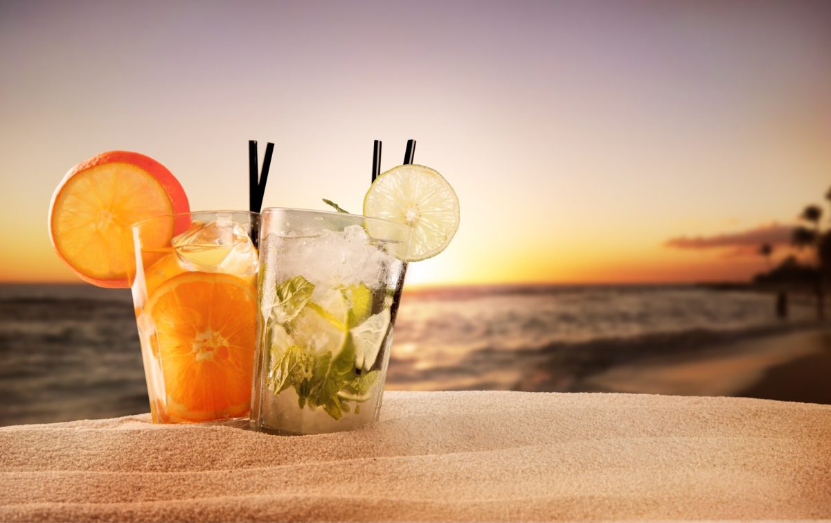 two cocktails on a sunset beach